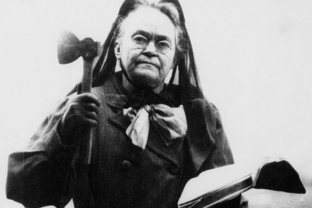 Carry A. Nation with her bible and her hatchet not long before she died in 1911.