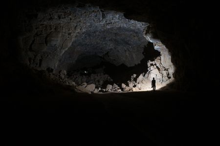 A researcher explores the depths of Umm Jirsan.