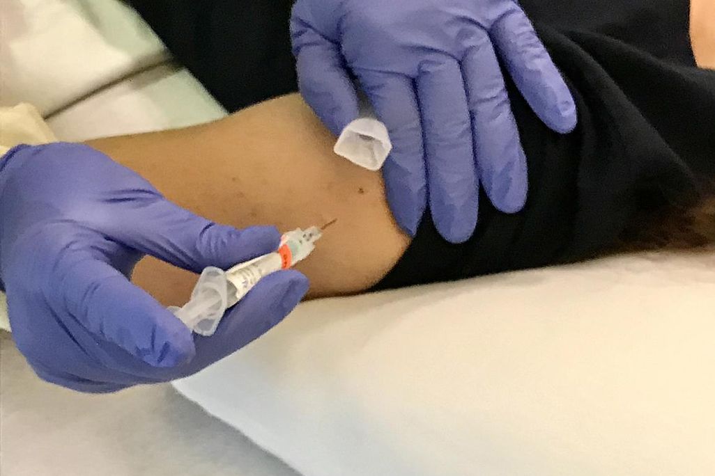 An image of a study participant recieving a flu vaccine for clinical trials