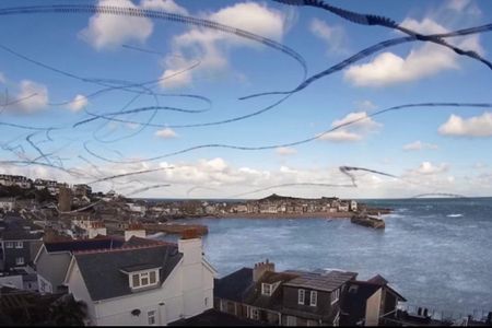 These fragmented black lines are actually seagulls flying