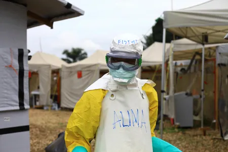 A health worker in protective gear works at an Ebola treatment centre in Beni, Eastern Congo in September 2018.