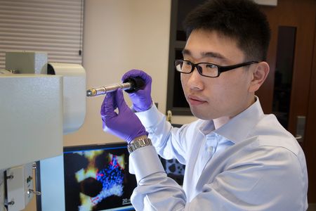 Materials scientist Huolin Xin, shown here at Brookhaven Lab's Center for Functional Nanomaterials, is optimistic that his team will find ways to improve batteries for future electric vehicles and portable electronics.