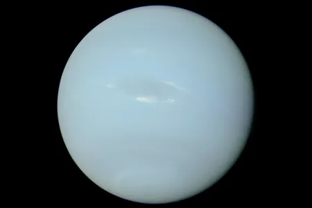 A photo of Neptune, taken by the Voyager 2 probe, with the colors rebalanced to represent its truest appearance