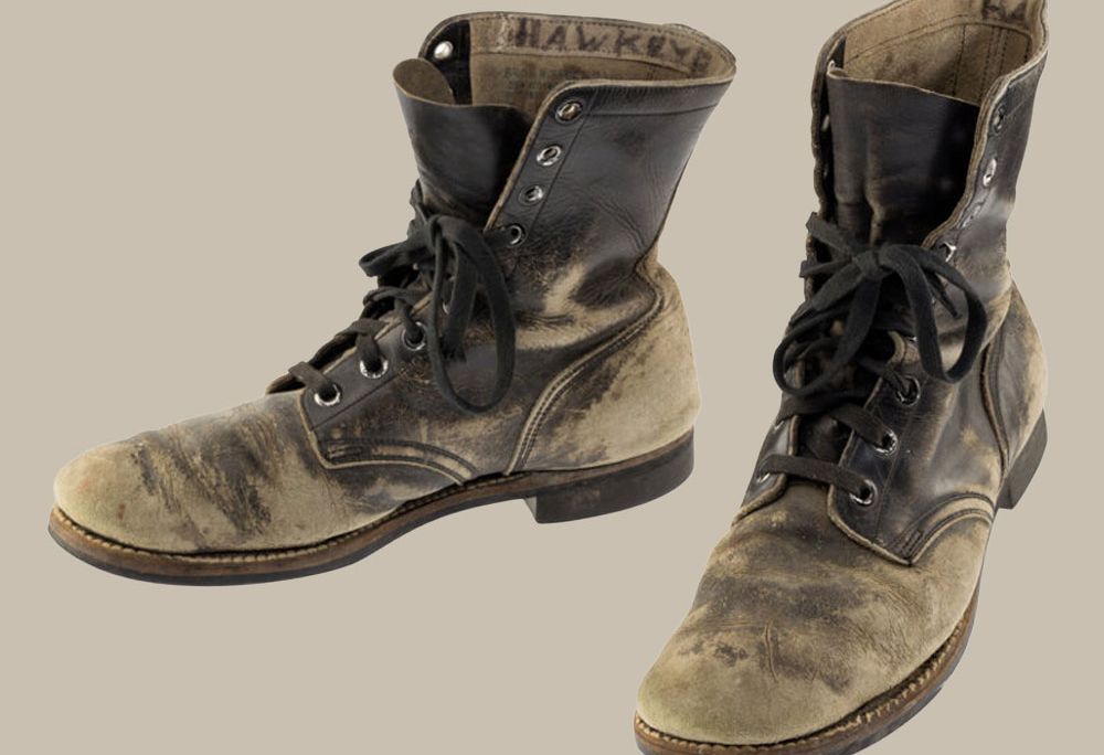 Alan Alda's scuffed combat boots