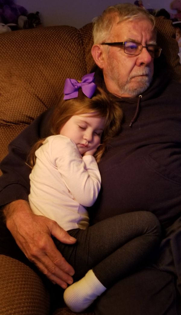 Nestled in the security of her grandfather's arm! thumbnail