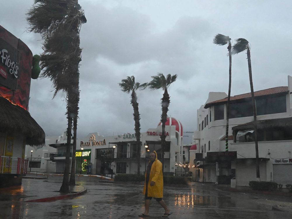 A man walks during a hurricane