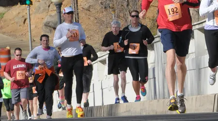 Human running is less efficient than the running of a typical mammal with the same body mass, a new study finds.