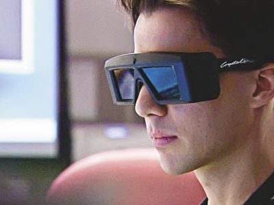 Driver Scott Maxwell uses 3-D goggles