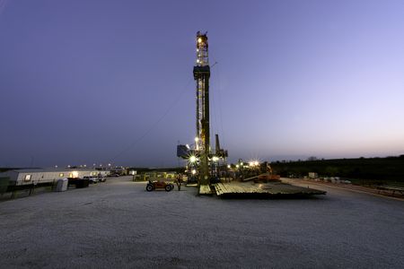 Among the many downsides of natural gas extraction are the small earthquakes caused by injecting wastewater back into the earth. Above, an oil rig drills for natural gas through shale.
