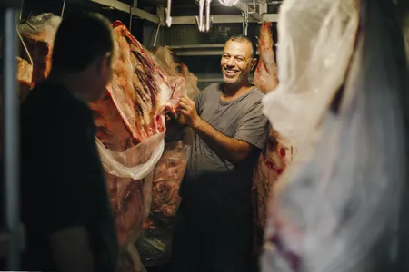 Butcher shop owner Sajad Saleh sells his wares at the Al Tayebat Meat Market. 