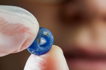 A blue bead uncovered at the Iron Age village archeological site in Norway.