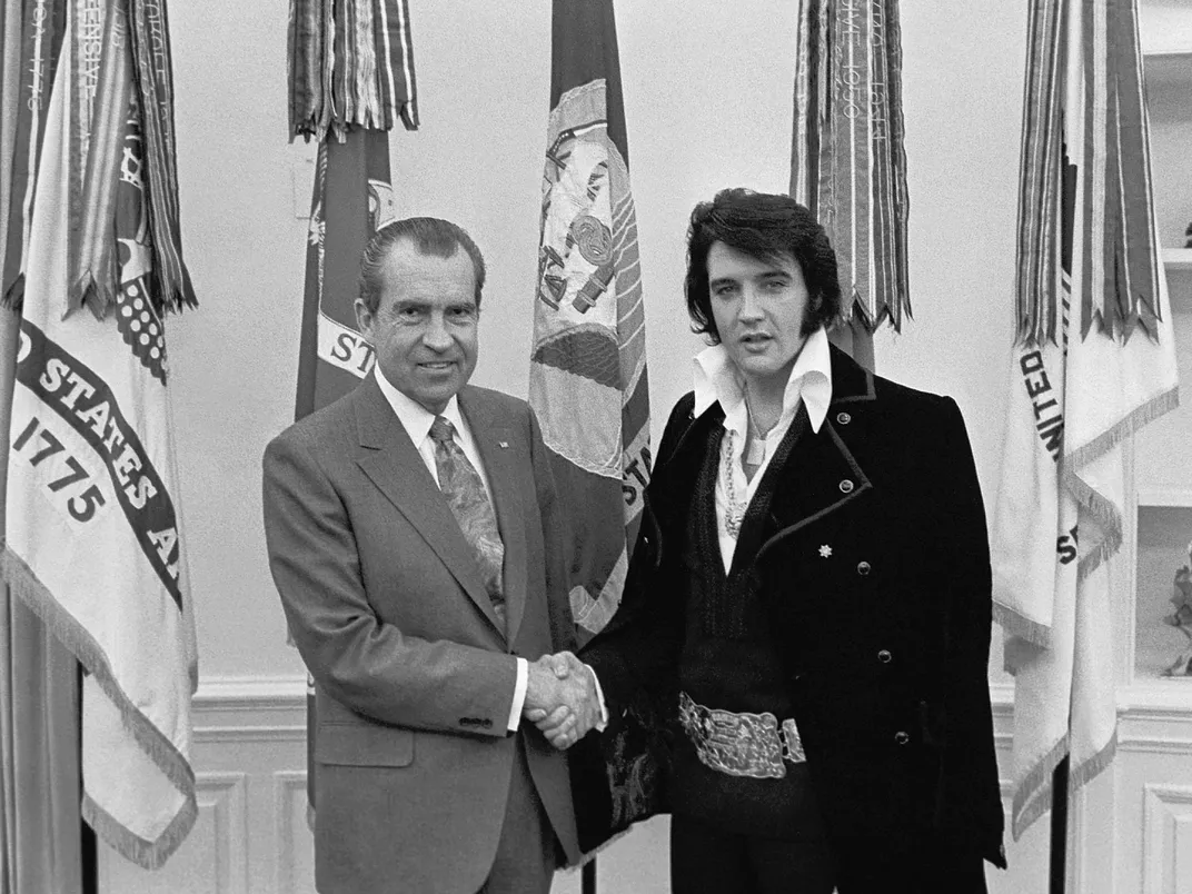 President Richard Nixon shakes hands with Elvis in the Oval Office in December 1970