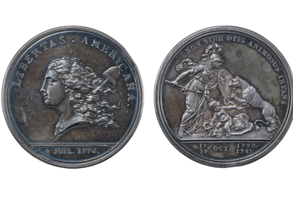 Two coins, one shows the "heads" side and one shows the "tails" side.