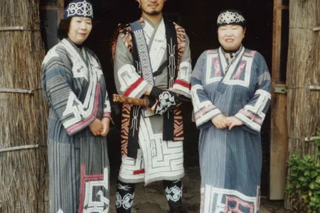 Ainu people wearing traditional clothes at the Ainu Museum, City of Shiraoi, Hokkaido, Japan.