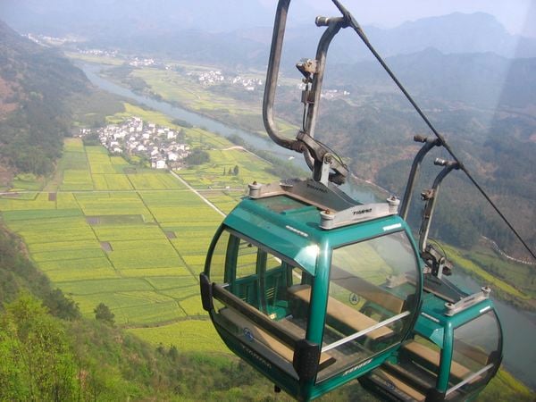 A cable car climbs over the villages at the foot of Qiyunshan thumbnail
