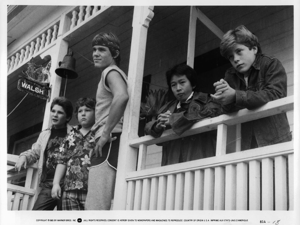 Corey Feldman, Jeff Cohen, Josh Brolin, Ke Huy Quand and Sean Astin standing on porch in a scene from the film 'Goonies'