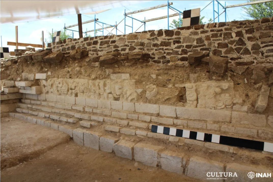 view of sand colored wall with stucco frieze