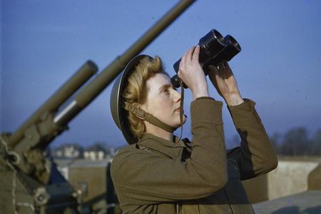 A spotter with binoculars at an anti-aircraft command post. 