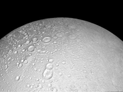Cameras captured snowy craters scattered across the moon's north side.