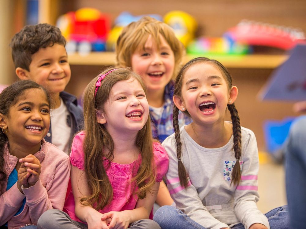 Laughing at teacher with book