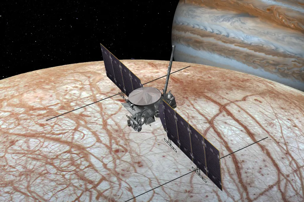 Artist's rendition of a spacecraft flying over Europa with Jupiter in the background