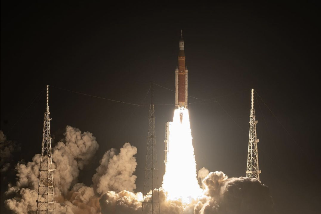 bright flame from the engines as a rocket ascends