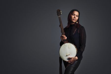 Giddens with her beloved cherry, maple and rosewood minstrel banjo, a replica of a design by the 19th-century Baltimore luthier Levi Brown.