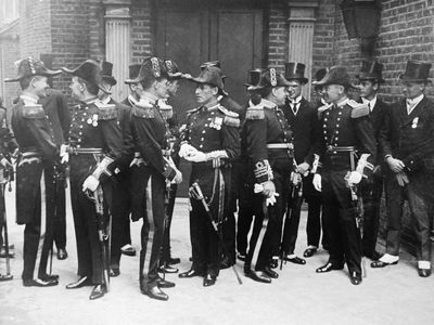 The King receives members of Scott's expedition at Buckingham Palace in England here. Shown are Lt. Bennie, Paymaster Drake, Paymaster Drake, Commander Campbell, Commander Evans, Commander Bruce, and Sir Levick, 1913.