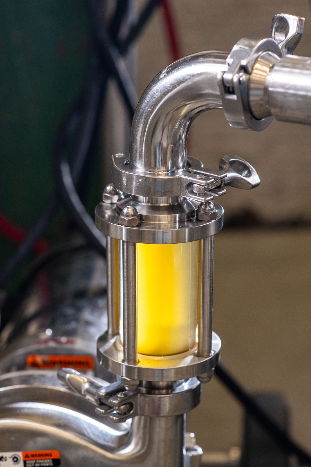 The sight glass allows mead makers to observe how the honey and water are blending in the tank without having to open the system.