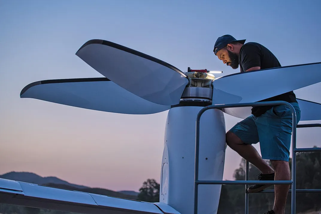 mechanic checks tilt-rotor