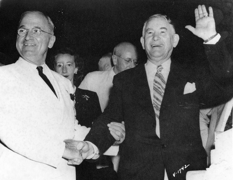 President Harry S. Truman (left) and Alben Barkley (right) smile while onstage at the 1948 Democratic National Convention in Philadelphia, Pennsylvania.