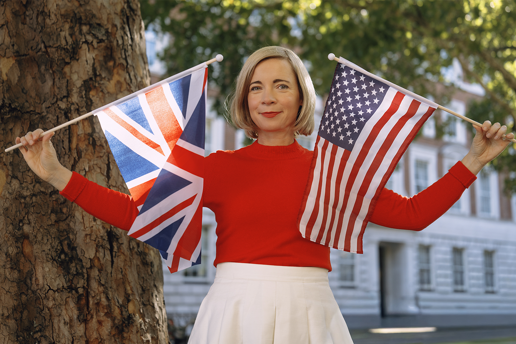 The British historian Lucy Worsley with a British flag and an American flag