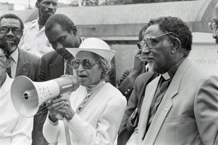 Rosa Parks addresses a crowd in 1989 on the 25th anniversary of the signing of the civil rights legislation. 