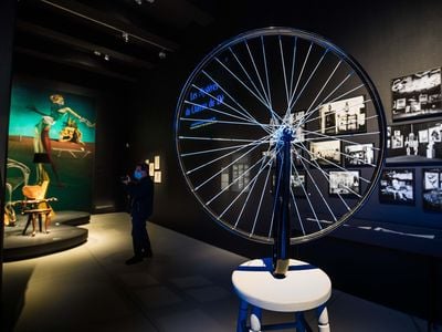 Installation view of "Objects of Desire," which features such Surrealist creations as a stool topped with a bicycle wheel