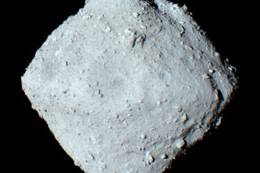 An image of the asteroid 162173 Ryugu  as it appears in space. The asteroid looks like a grey diamond shaped chunk.
