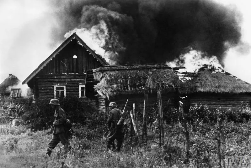 German troops occupy a burning Russian village in summer 1941