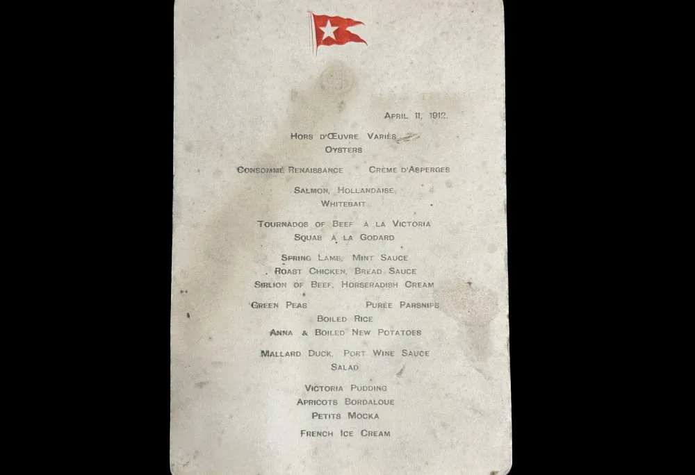 Piece of white paper with smudges and a red flag at the top