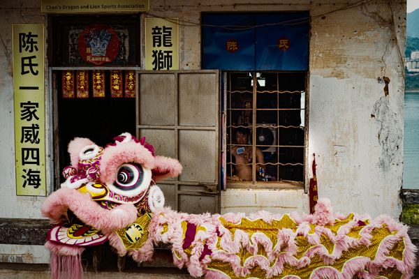 Shirtless lion dance performers playing poker thumbnail