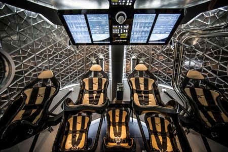 The no-cockpit interior of the Crew Dragon shows how automation will change spaceflight. ISS commuters can steer if needed, but will often be along for the ride.