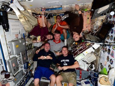 Astronauts enjoy a Thanksgiving feast on the International Space Station in 2014. Turns out that modern space food is something to be grateful for. 