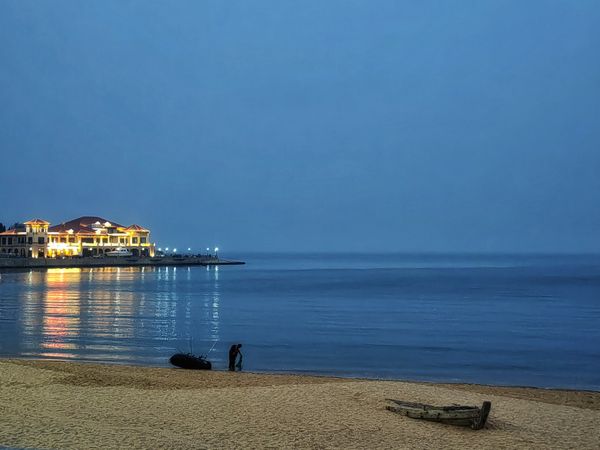 Seaside Twilight: A Beachcomber and Stillness thumbnail