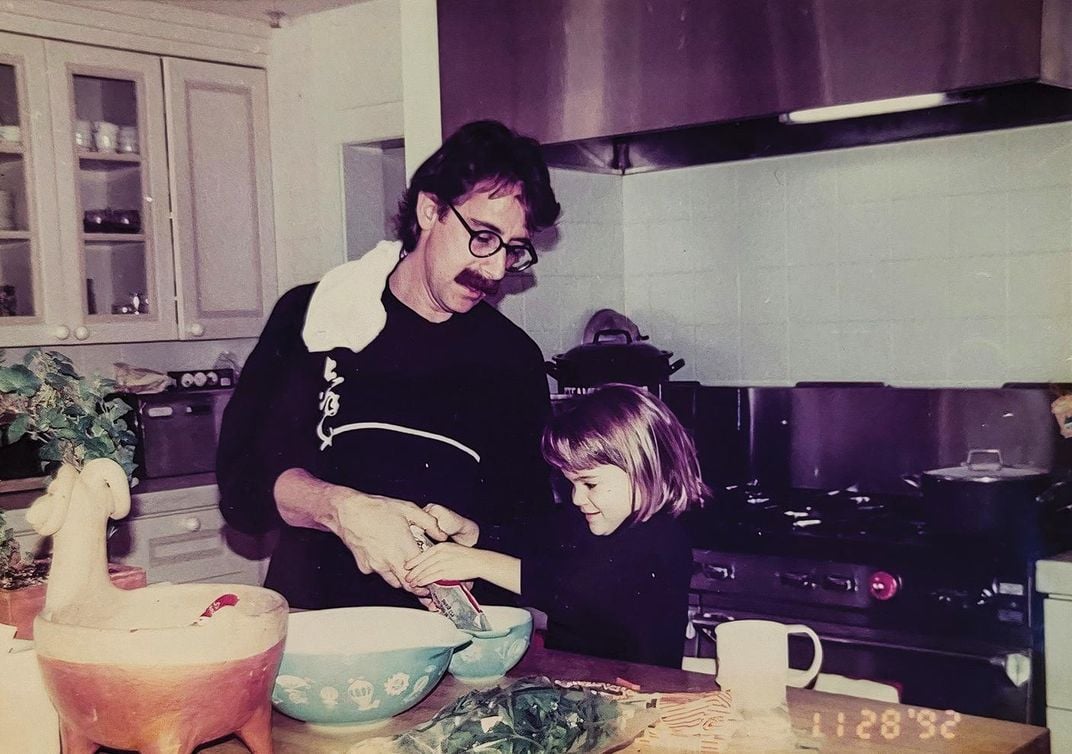 father and daughter cooking 