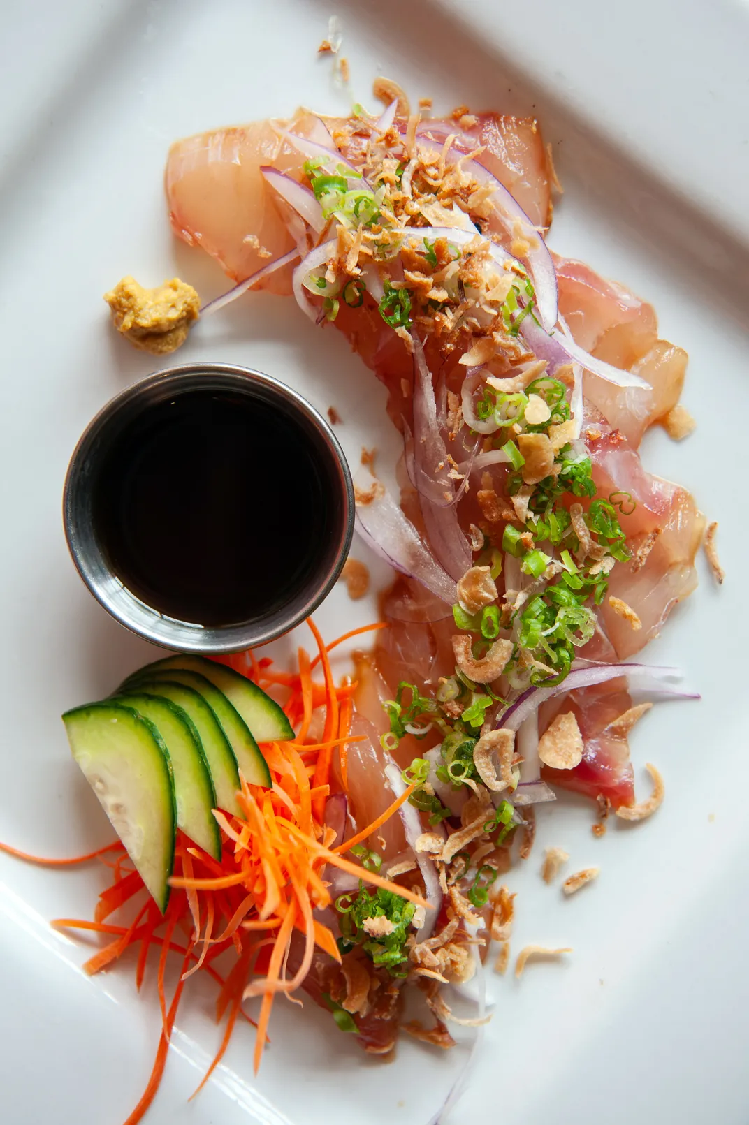 a plated dish of red snapper