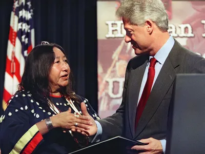 Tillie Black Bear accepts congratulations from President Bill Clinton after receiving the Eleanor Roosevelt Human Rights Award in December 2000.