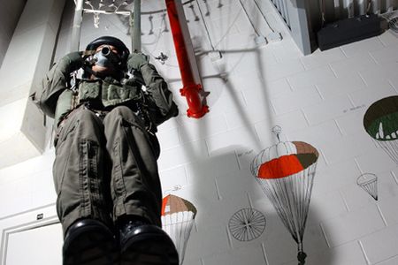 021115-N-5862D-002 NAS PENSACOLA-- "Just Hanging Around"  Hospital Corpsman Second Class, Jerry Morrish, 33 from Katy, Texas., demonstrates how students at the Naval Survival Training Institute get familiarized to a  parachute harness' and how it is controlled.(Photo by PHC(NAO) Chris Desmond COMNAVCRUITCOM)