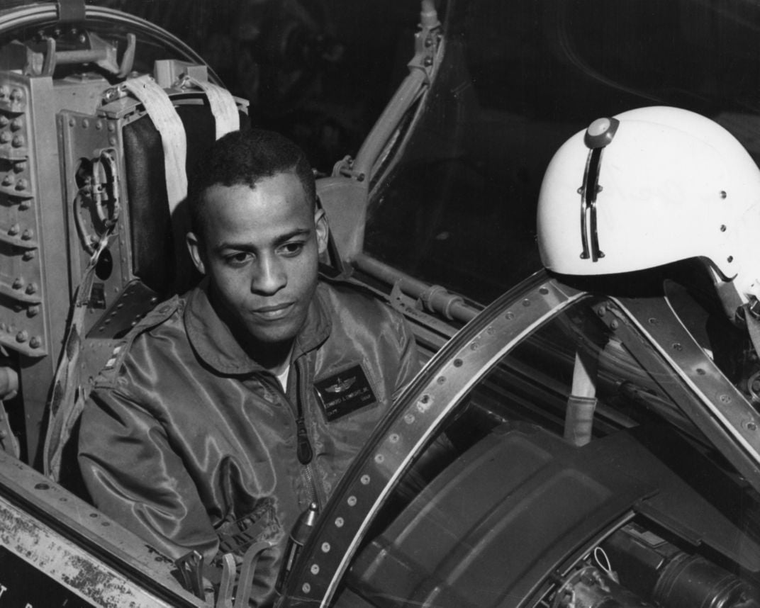 Ed Dwight, a young Black man, in the cockpit of a plane