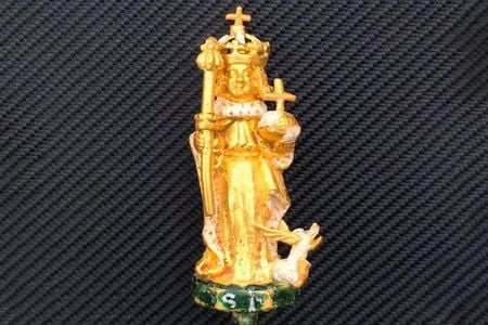 The gold figurine stands just 2.5 inches tall.