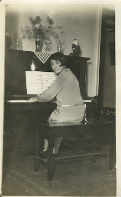 Arias at the piano in her apartment in Brooklyn, circa 1925