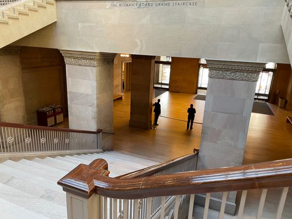 In good company. Two Art Institute of Chicago employees look towards the entrance. thumbnail