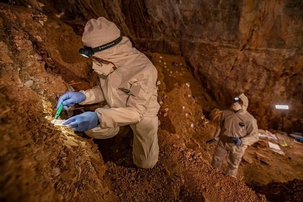 A photo of reseachers collecting ancient soil samples from a cave in Northern Mexico